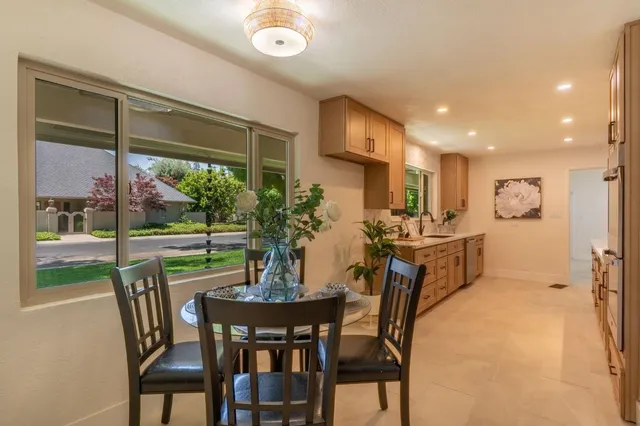 a view of a dining room with furniture window and outside view