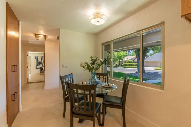 a view of a dining room with furniture window and outside view