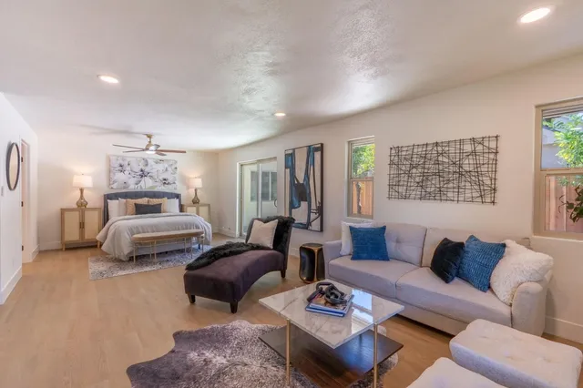 a bedroom with furniture and a chandelier