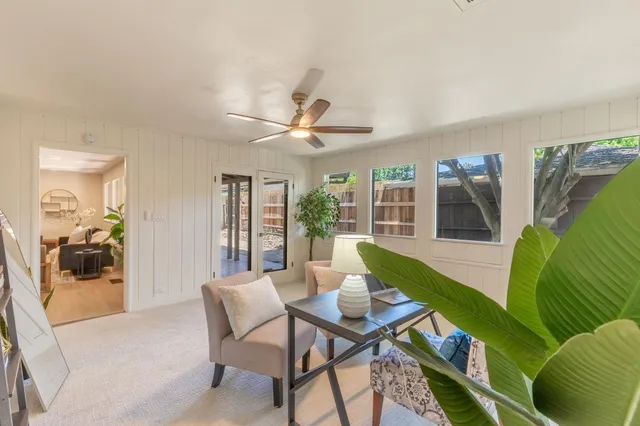 a bathroom with a granite countertop toilet sink and mirror