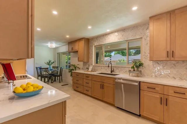 a kitchen with sink and window