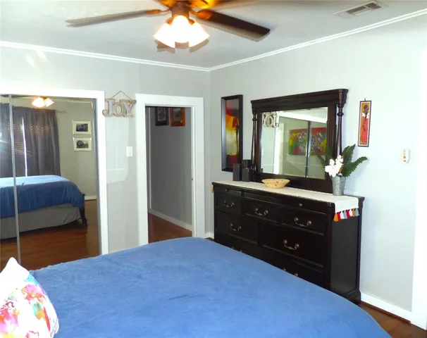 a bedroom with a bed and a dresser