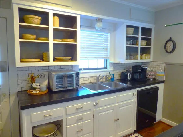a kitchen with a sink and a window