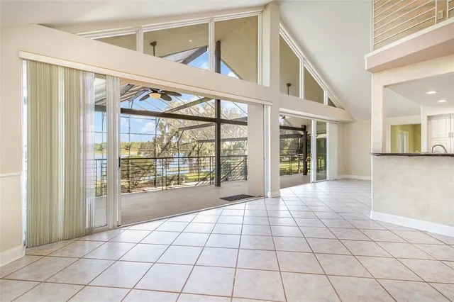 a spacious bathroom with a granite countertop tub sink and mirror