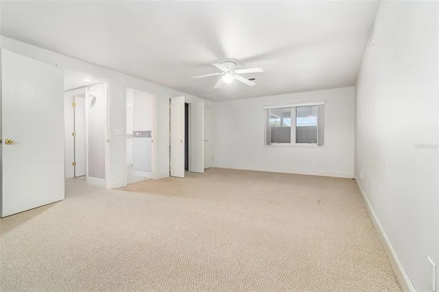 an aerial view of a house with a garden and swimming pool