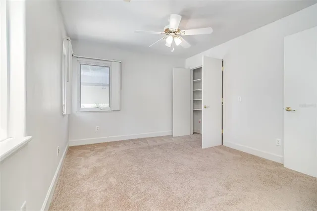 an aerial view of a houses with a lake view