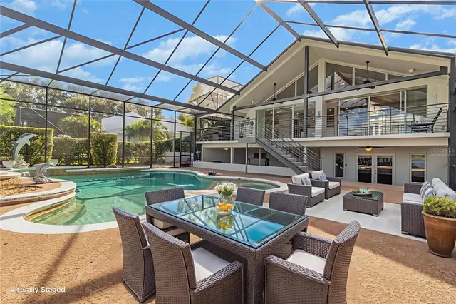 a view of a patio with a table and chairs