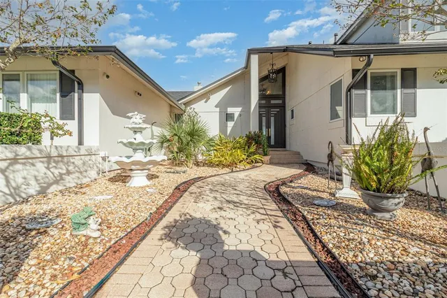 a view of an empty room with a fireplace and a large window