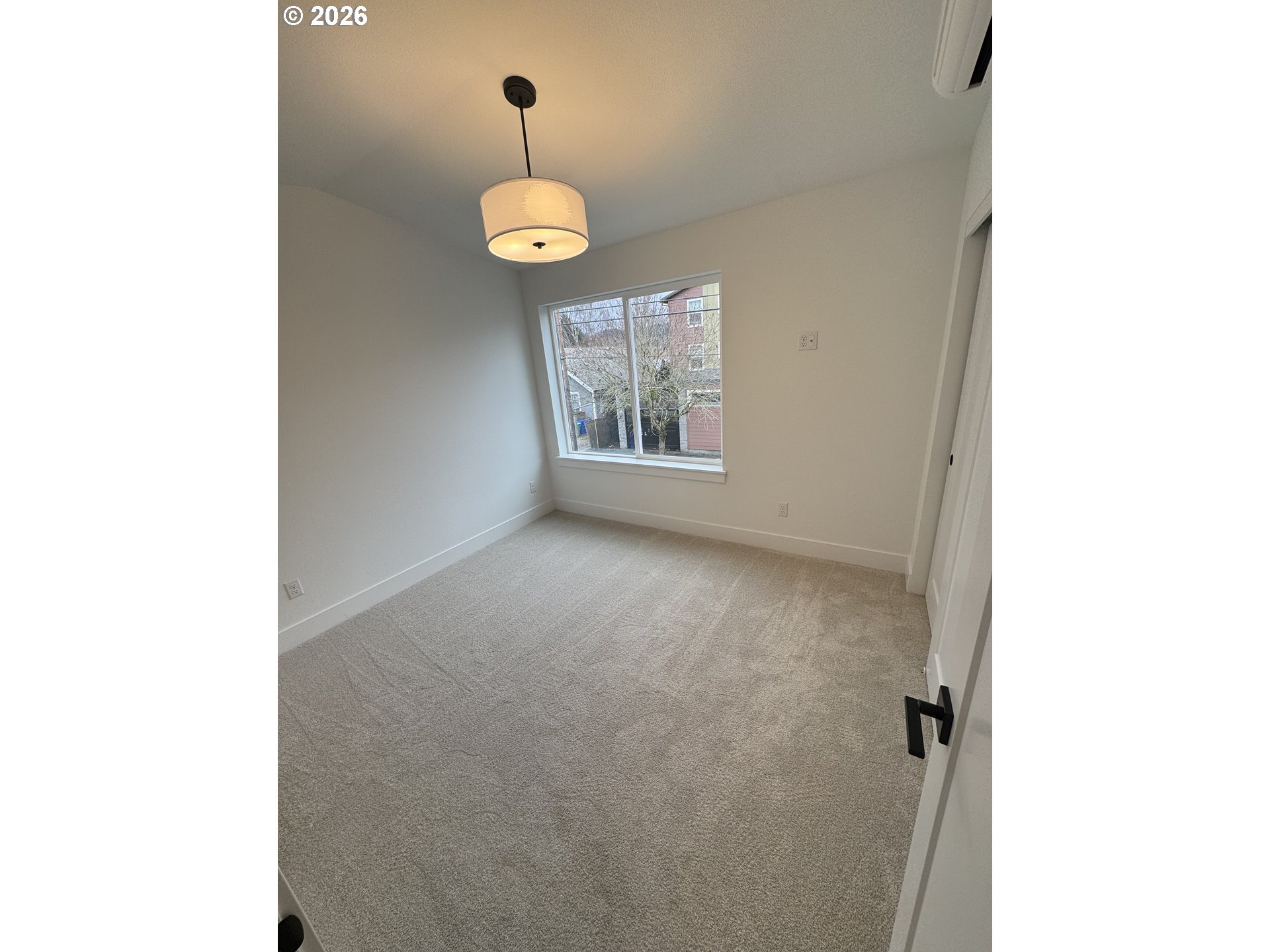 2383 Southeast 43rd Avenue Portland, OR 97206 - Photo 12 of 24 a view of an empty room with a window