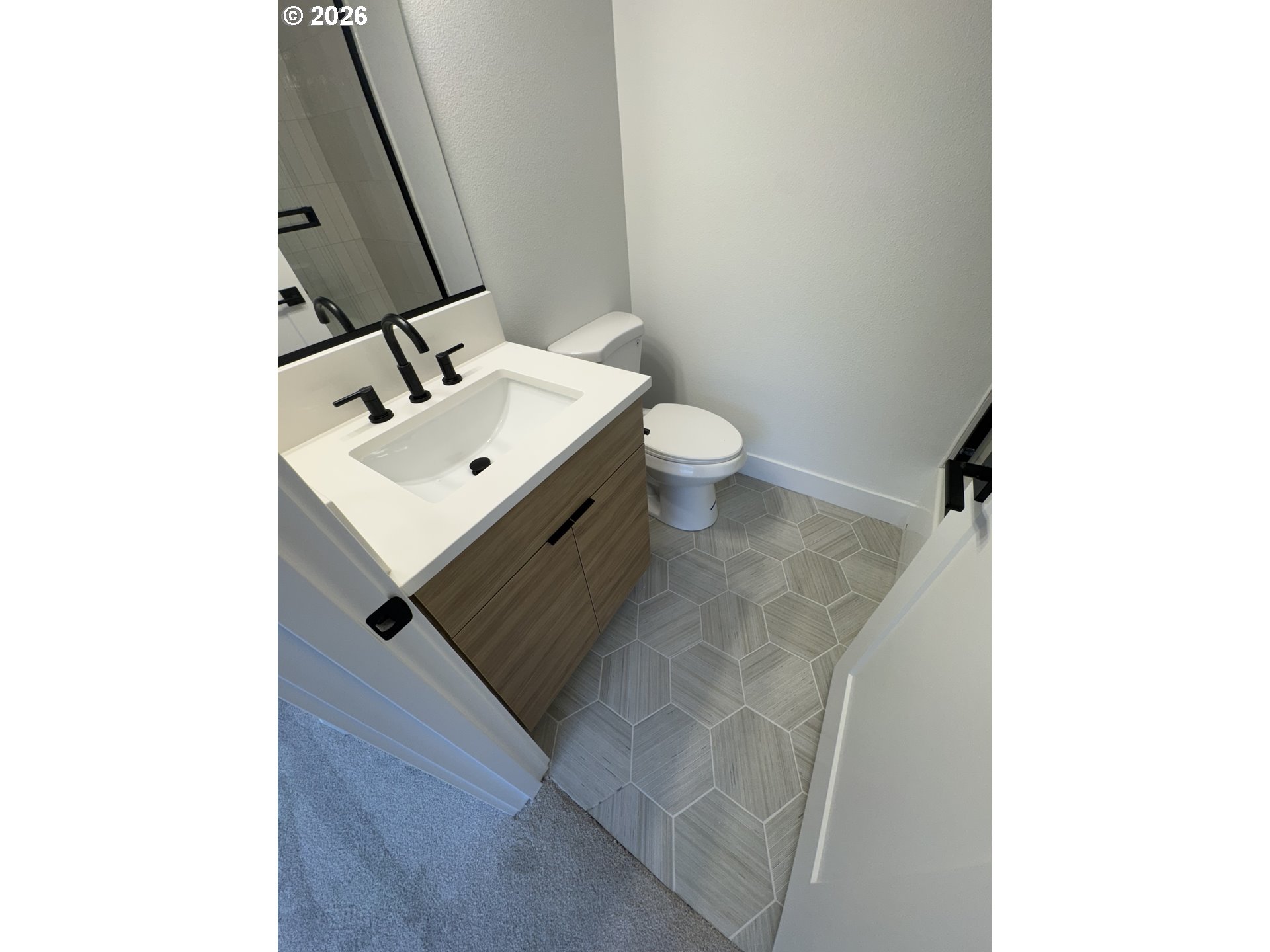 2383 Southeast 43rd Avenue Portland, OR 97206 - Photo 20 of 24 a bathroom with a sink toilet and mirror