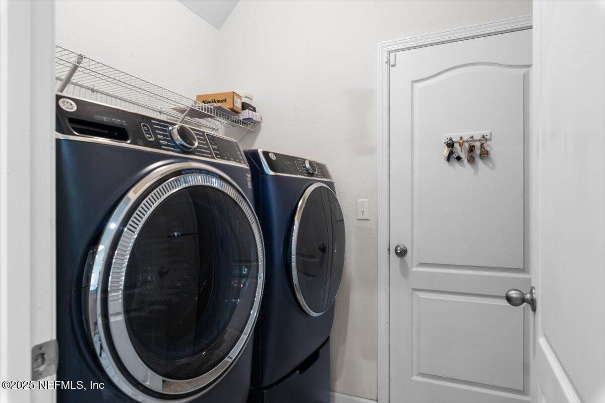 1011 Wetland Ridge Circle Middleburg, FL 32068 - Photo 17 of 73 a utility room with dryer and washer