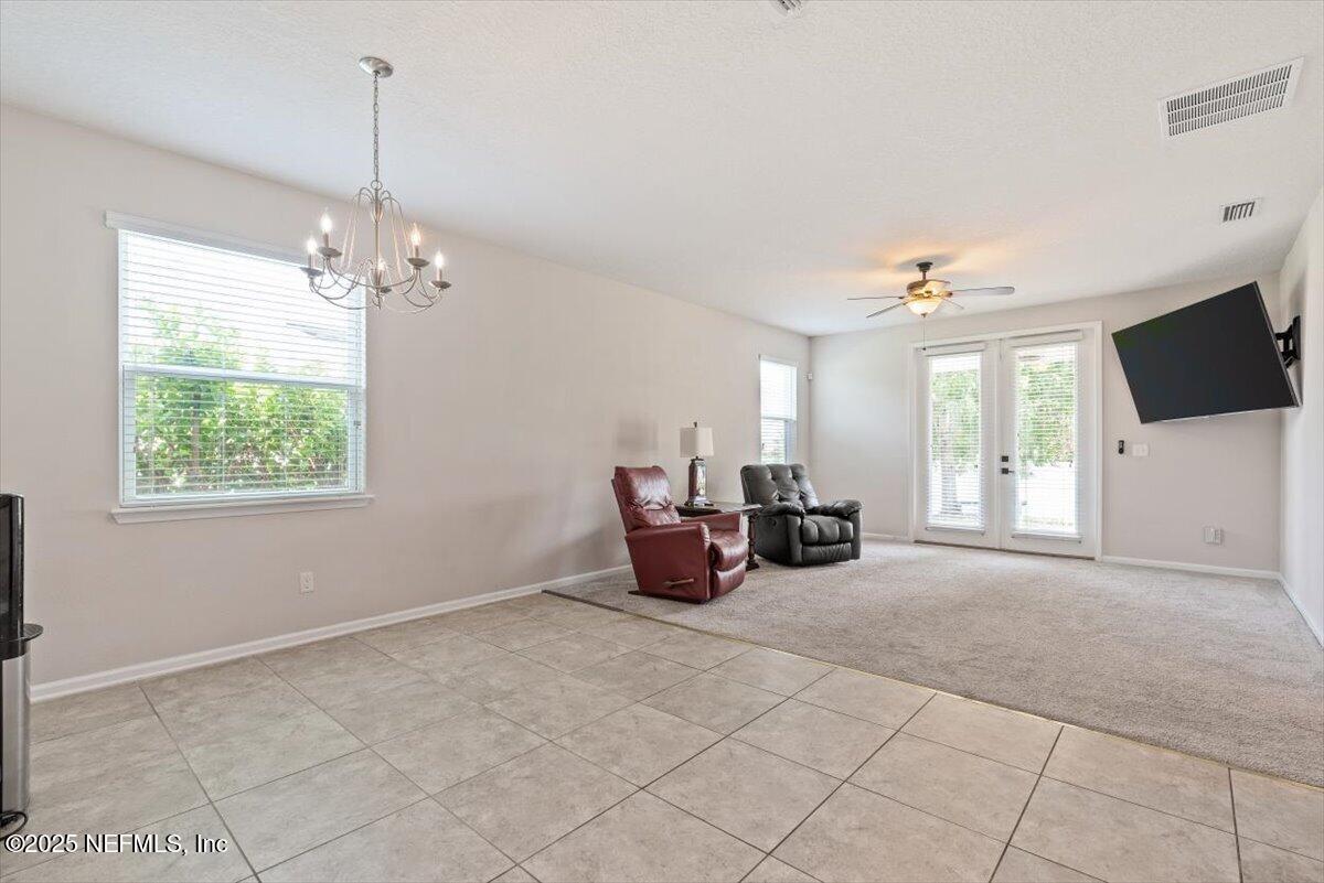 1011 Wetland Ridge Circle Middleburg, FL 32068 - Photo 19 of 73 a very nice looking room with furniture and a flat screen tv