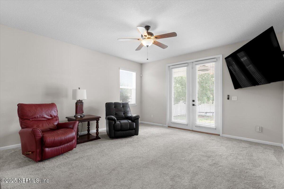 1011 Wetland Ridge Circle Middleburg, FL 32068 - Photo 23 of 73 a living room with furniture and a flat screen tv