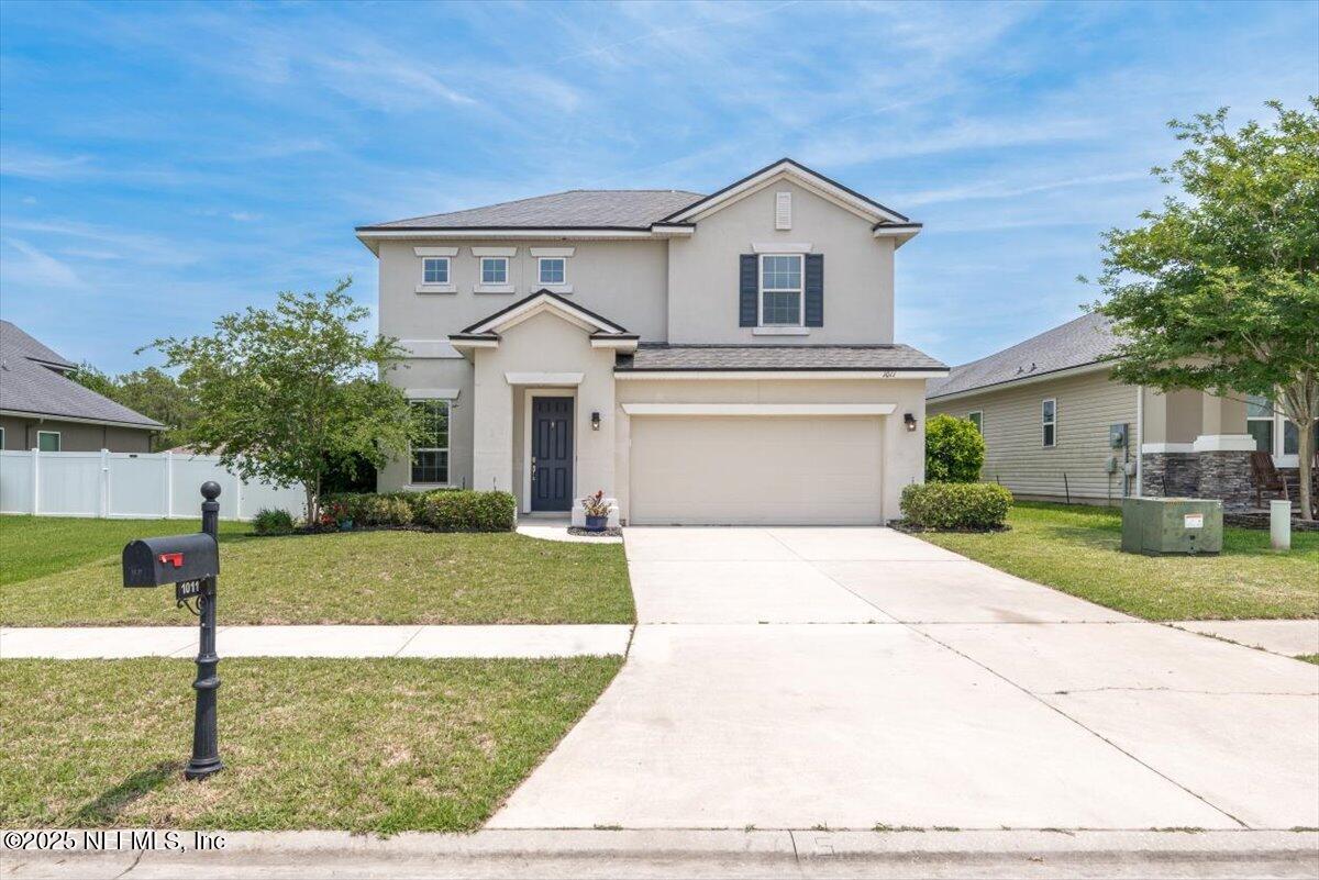 1011 Wetland Ridge Circle Middleburg, FL 32068 - Photo 3 of 73 a front view of a house with a yard