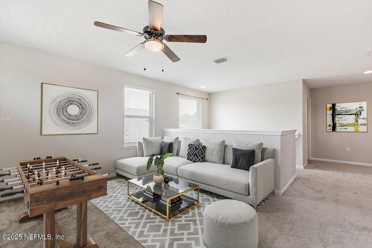 1011 Wetland Ridge Circle Middleburg, FL 32068 - Photo 31 of 73 a living room with furniture and a window