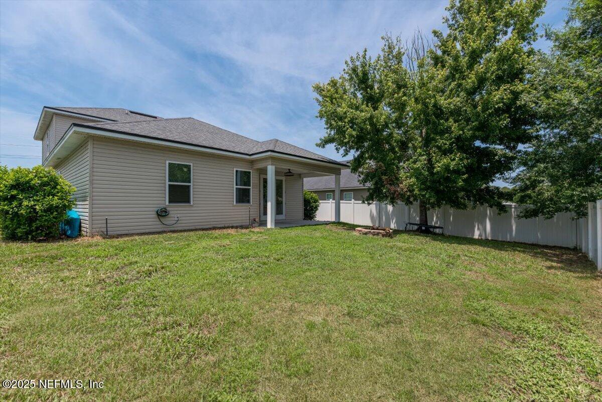 1011 Wetland Ridge Circle Middleburg, FL 32068 - Photo 50 of 73 front view of a house with a yard