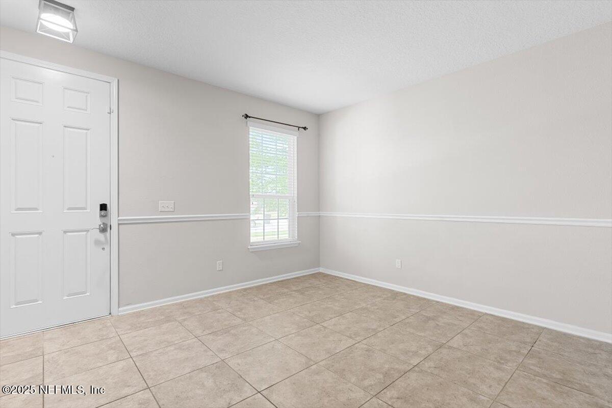 1011 Wetland Ridge Circle Middleburg, FL 32068 - Photo 8 of 73 a view of an empty room with a window
