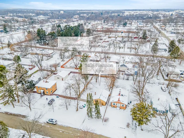 an aerial view of residential building and parking space