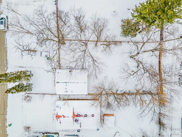 a view of covered with snow in front of house