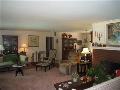 6 Shell Lane Orleans, MA 02653 - Photo 7 of 17 a living room with furniture and a floor to ceiling window