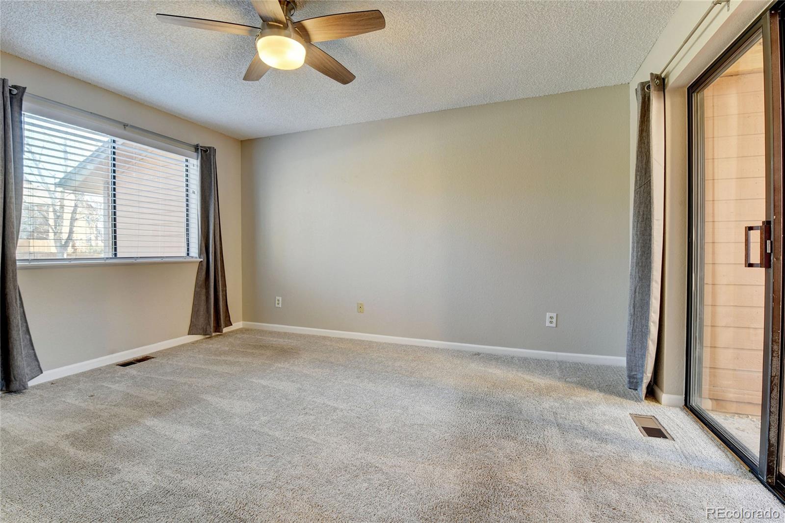9501 West 89th Circle Broomfield, CO 80021 - Photo 13 of 33 an empty room with windows and fan