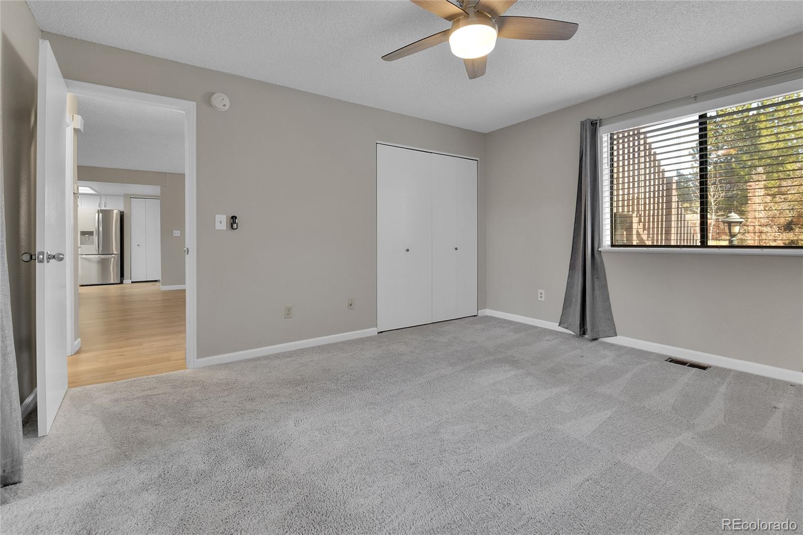 9501 West 89th Circle Broomfield, CO 80021 - Photo 14 of 33 a view of an empty room with a window