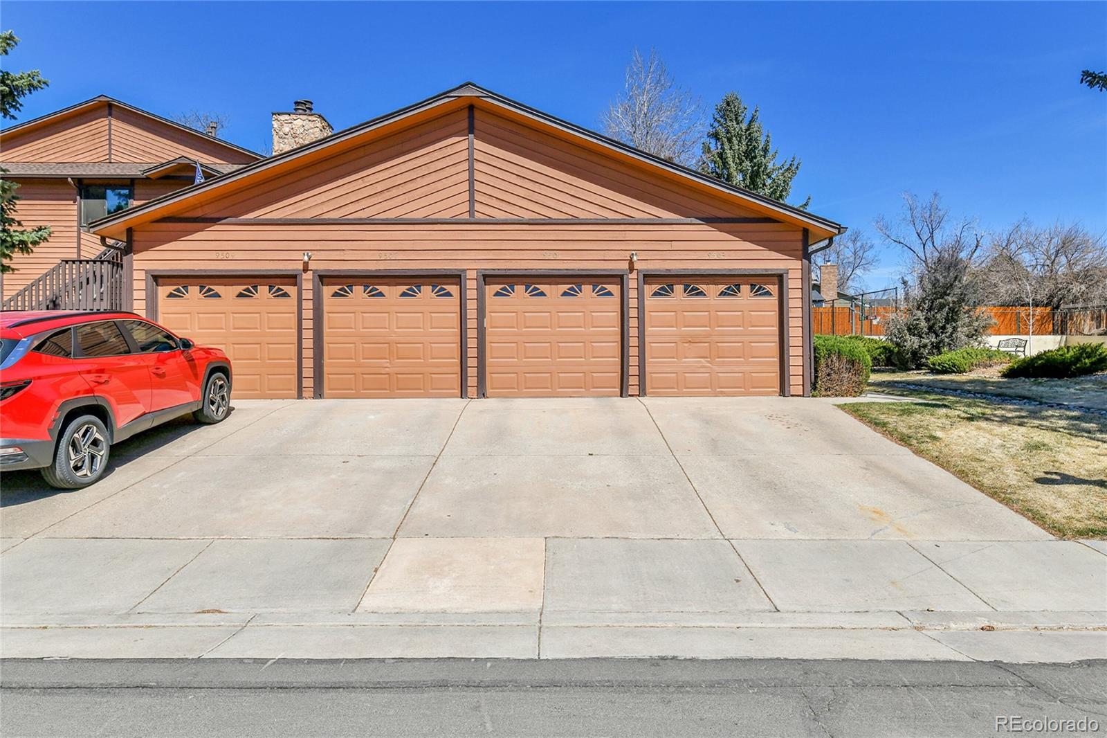 9501 West 89th Circle Broomfield, CO 80021 - Photo 21 of 33 a front view of a house with a yard