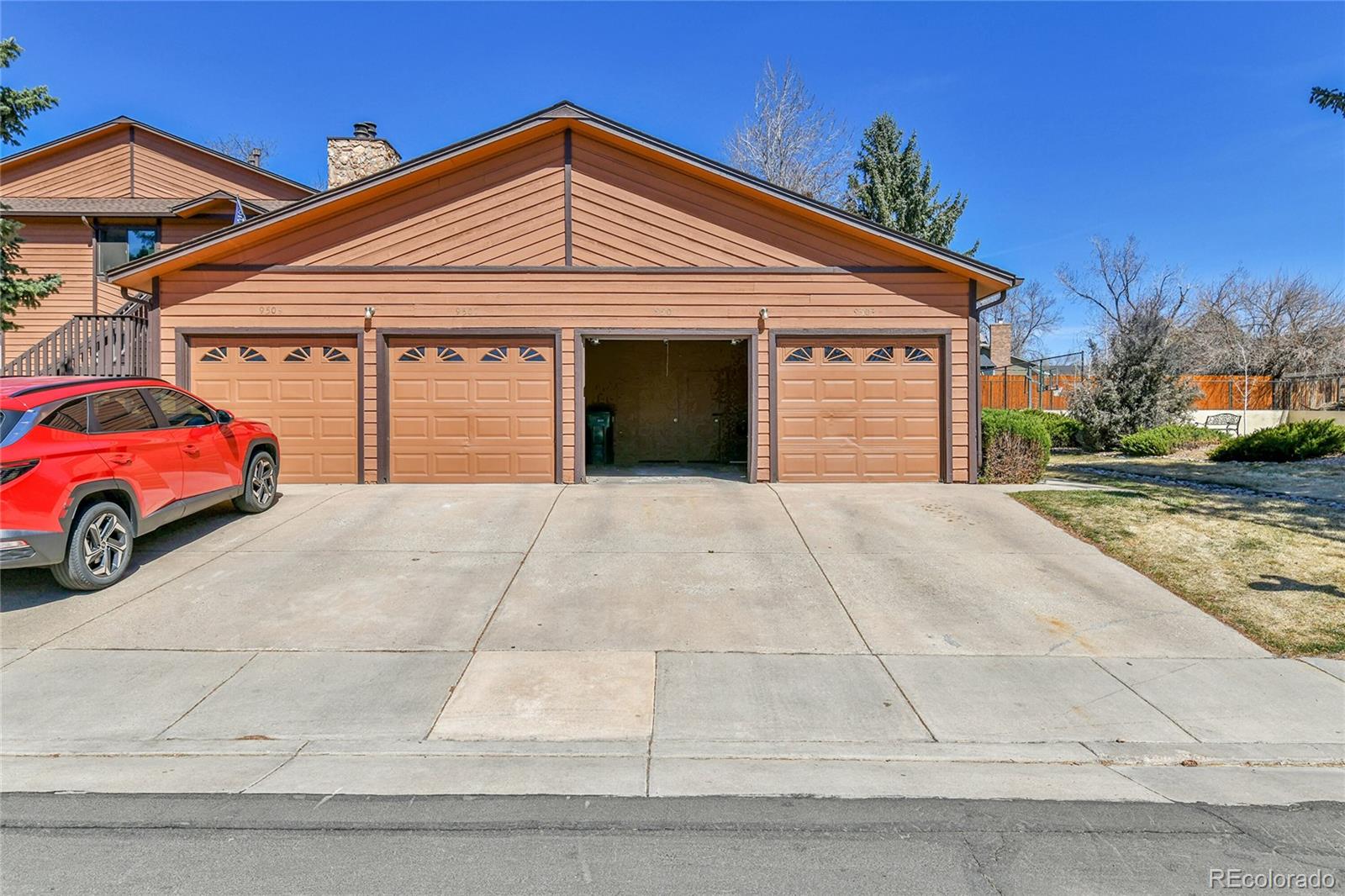 9501 West 89th Circle Broomfield, CO 80021 - Photo 22 of 33 a front view of a house with a yard and garage