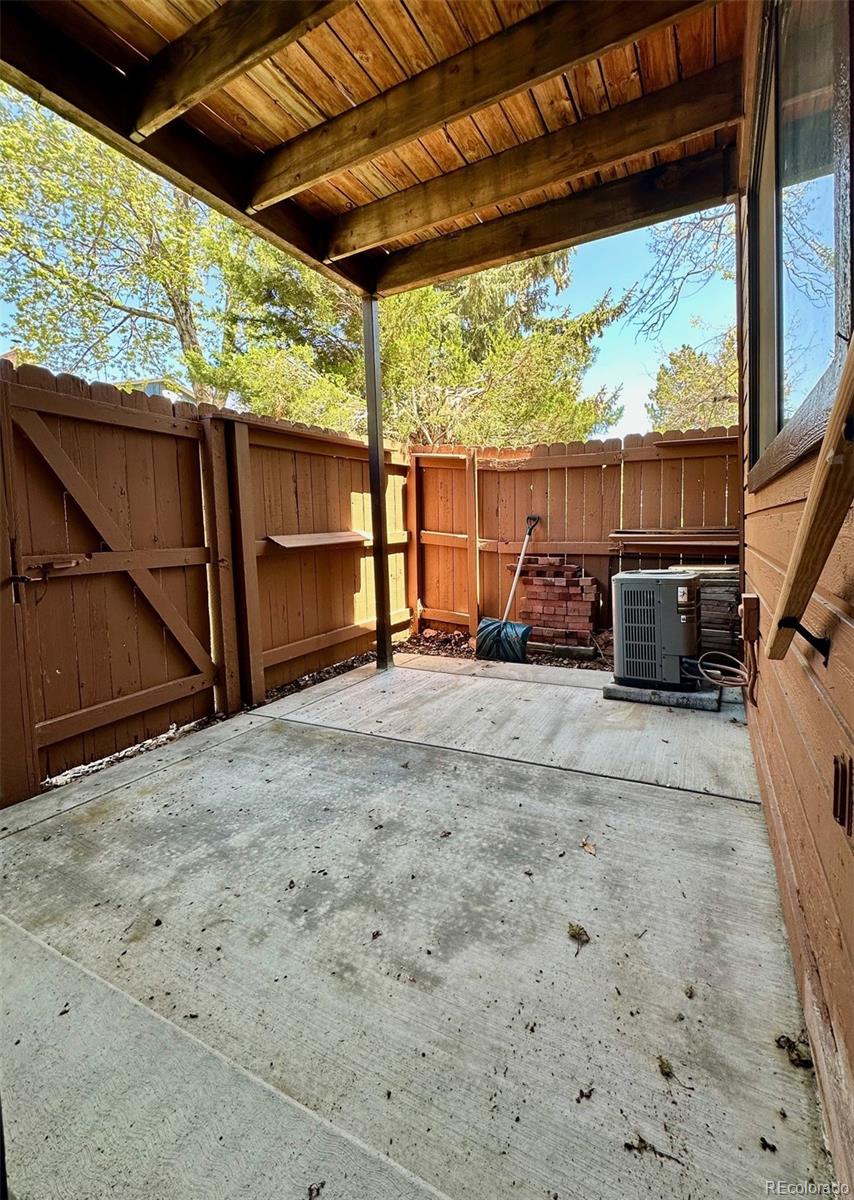 9501 West 89th Circle Broomfield, CO 80021 - Photo 26 of 33 a backyard of a house with a swing chair and table