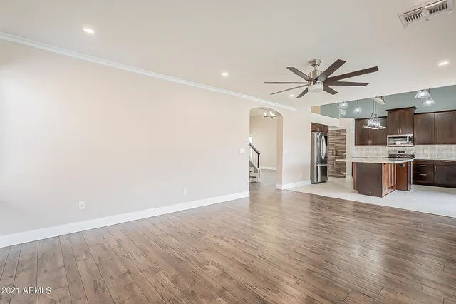 a view of a kitchen with a sink and a refrigerator