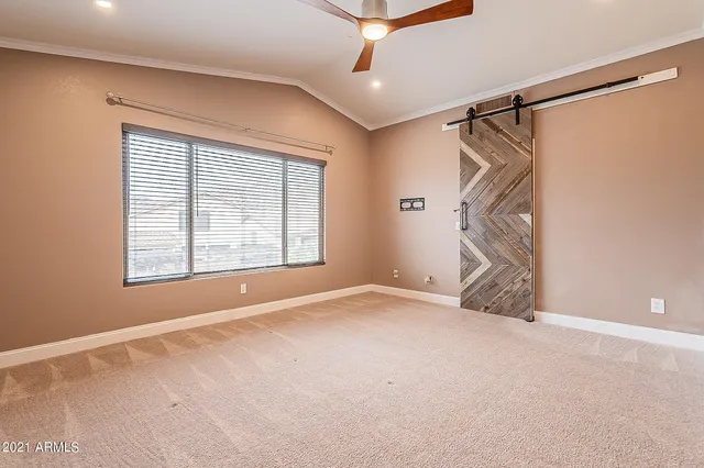 a view of an empty room with a window