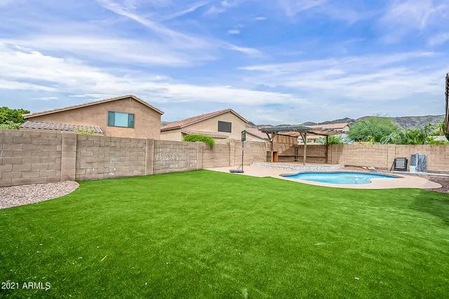 a view of a garden with a large tree
