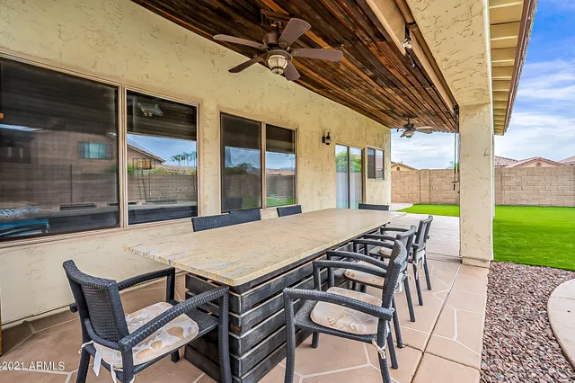 a view of an outdoor space with furniture and garden