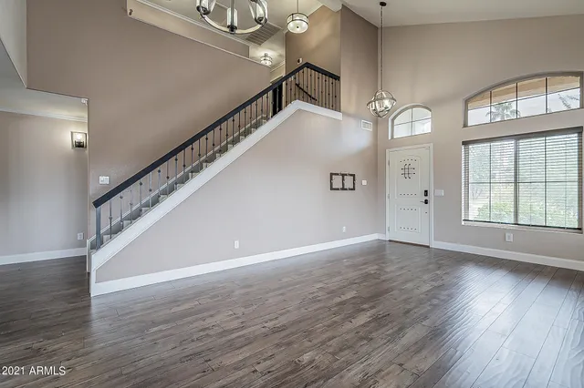 a view of an entryway with wooden floor