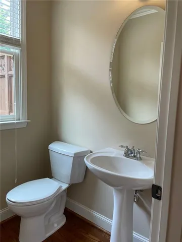 a view of a livingroom with furniture and a window