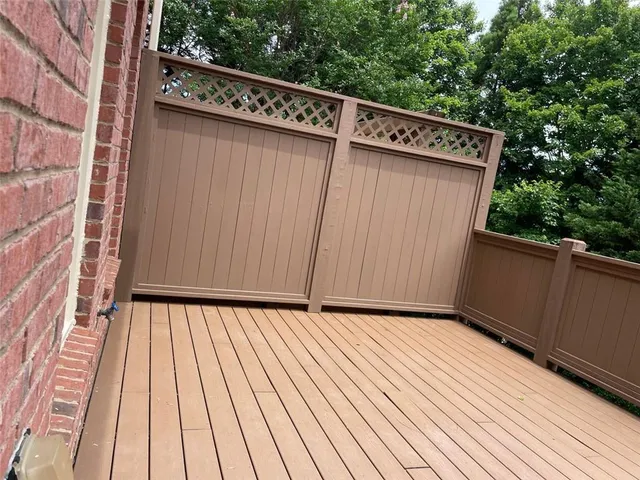 a kitchen with stainless steel appliances granite countertop a sink a stove a refrigerator and island