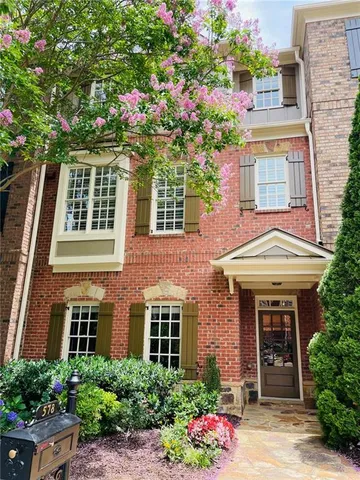 a front view of a house having yard