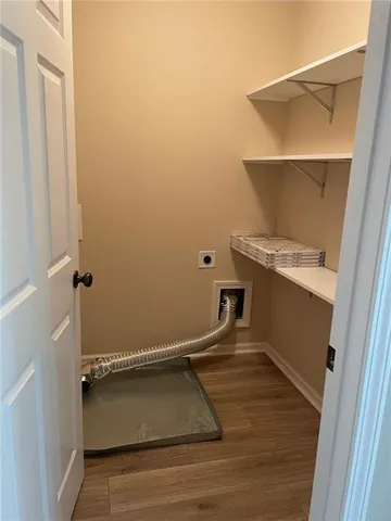 a view of a hallway with closet