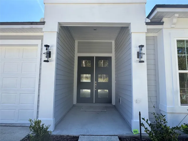 front view of a house with a glass door and shower