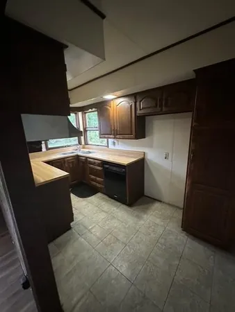 a kitchen with a stove a sink and a microwave