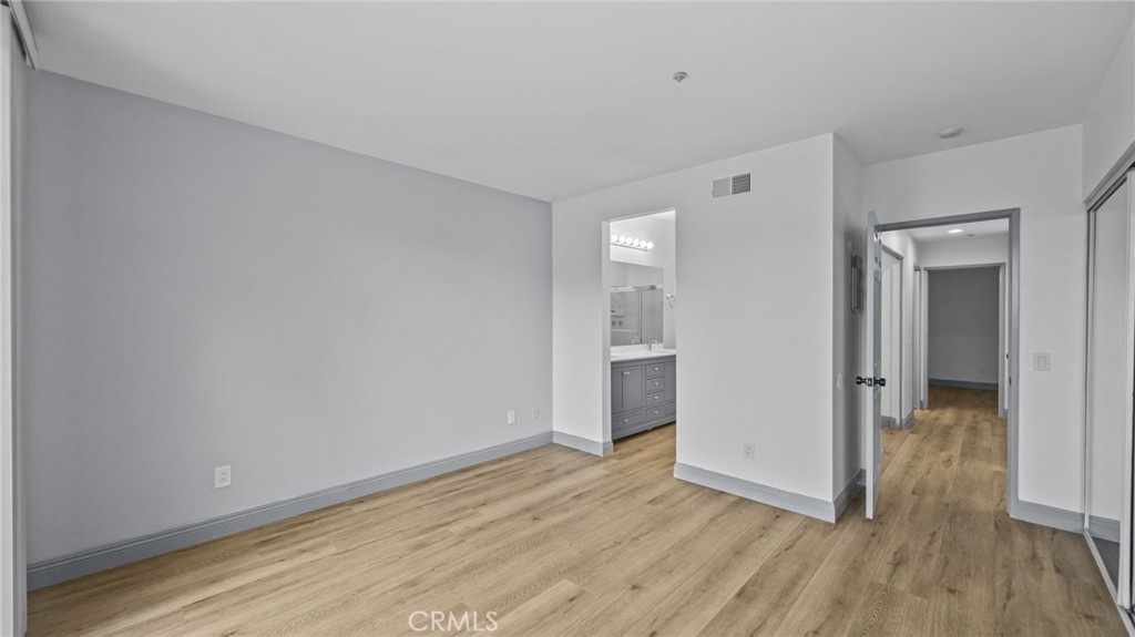 2901 Vía Toscana, Unit 101 Corona, CA 92879 - Photo 13 of 28 a view of a room with wooden floor