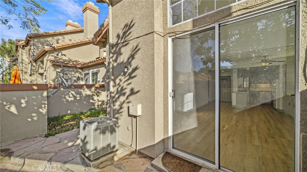 2901 Vía Toscana, Unit 101 Corona, CA 92879 - Photo 21 of 28 a bathroom with a glass shower door and a mirror
