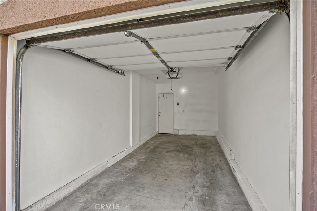 2901 Vía Toscana, Unit 101 Corona, CA 92879 - Photo 23 of 28 a view of hallway with a ceiling fan