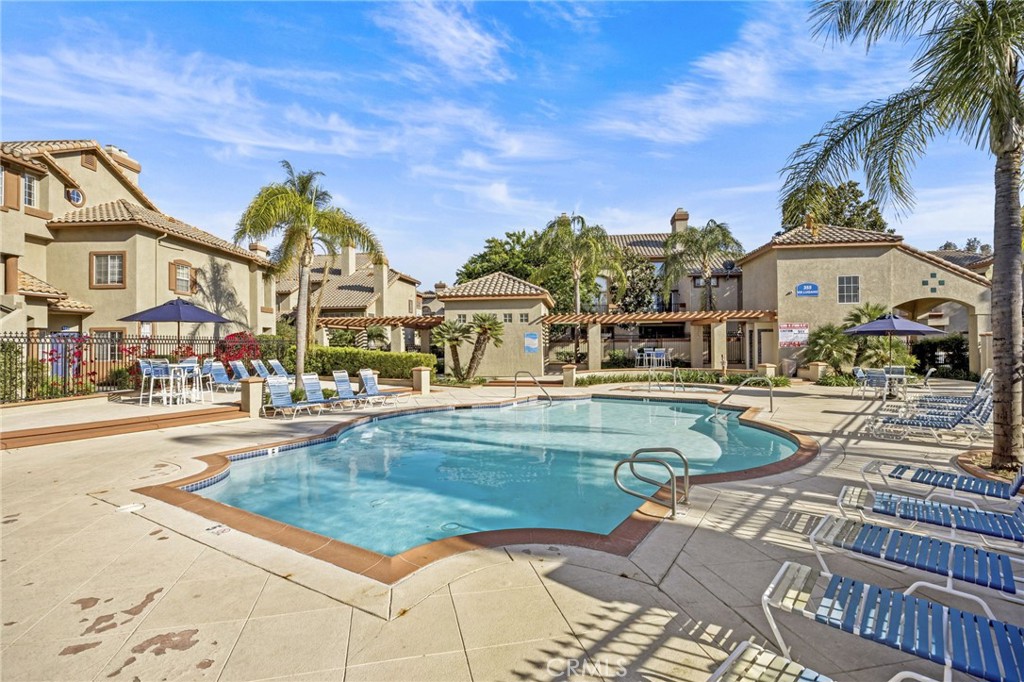 2901 Vía Toscana, Unit 101 Corona, CA 92879 - Photo 24 of 28 a view of a house with swimming pool and sitting area