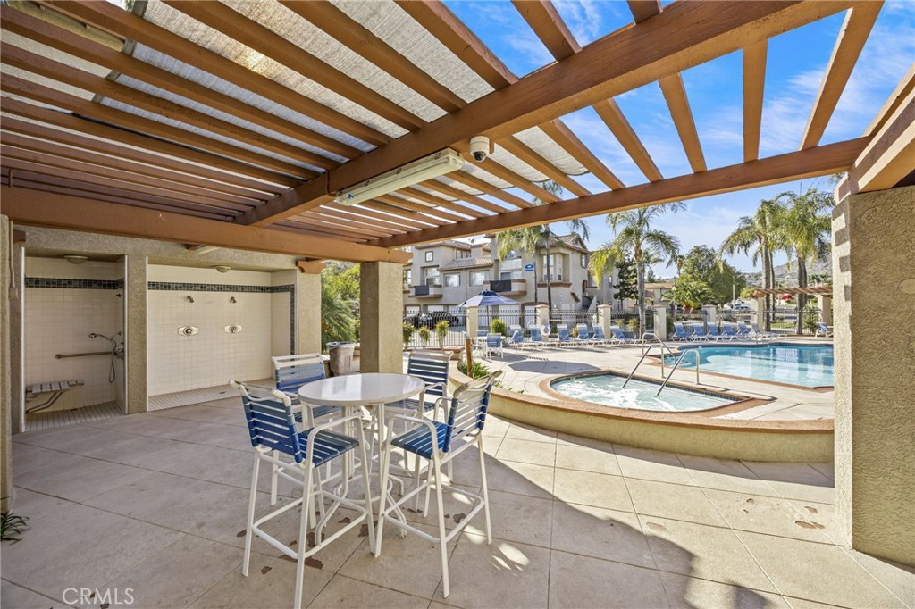 2901 Vía Toscana, Unit 101 Corona, CA 92879 - Photo 27 of 28 a dining room with furniture and a large window
