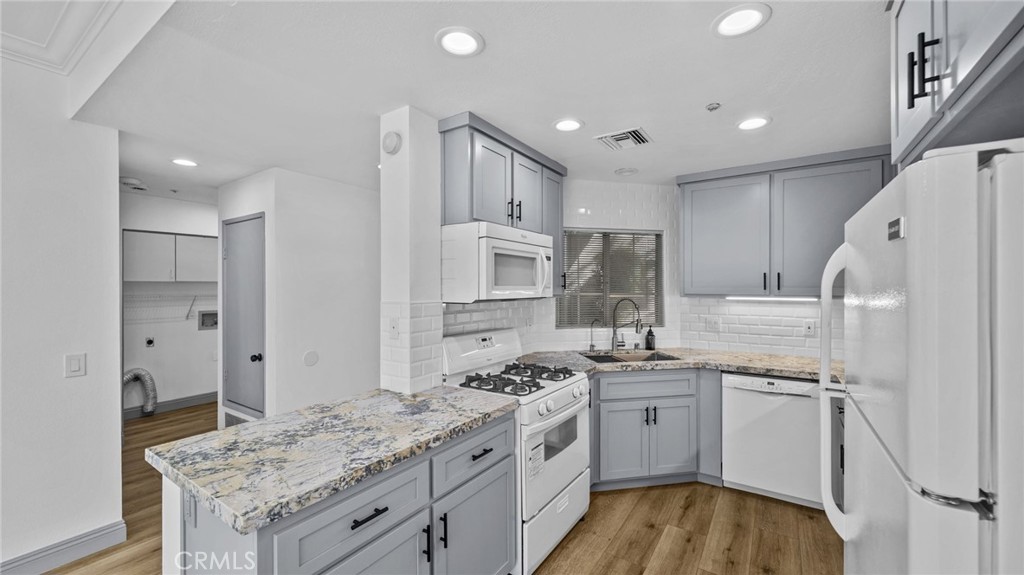 2901 Vía Toscana, Unit 101 Corona, CA 92879 - Photo 6 of 28 a kitchen with a sink stove and refrigerator
