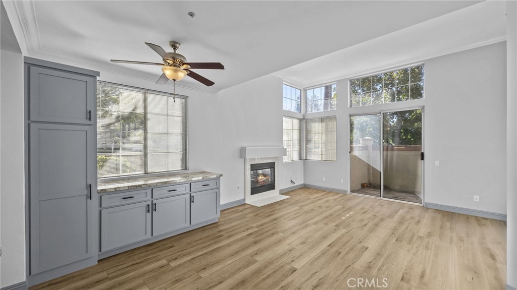 2901 Vía Toscana, Unit 101 Corona, CA 92879 - Photo 8 of 28 a view of a kitchen with a sink and cabinet with wooden floor