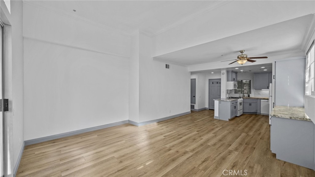 2901 Vía Toscana, Unit 101 Corona, CA 92879 - Photo 10 of 28 a view of a kitchen with wooden floor