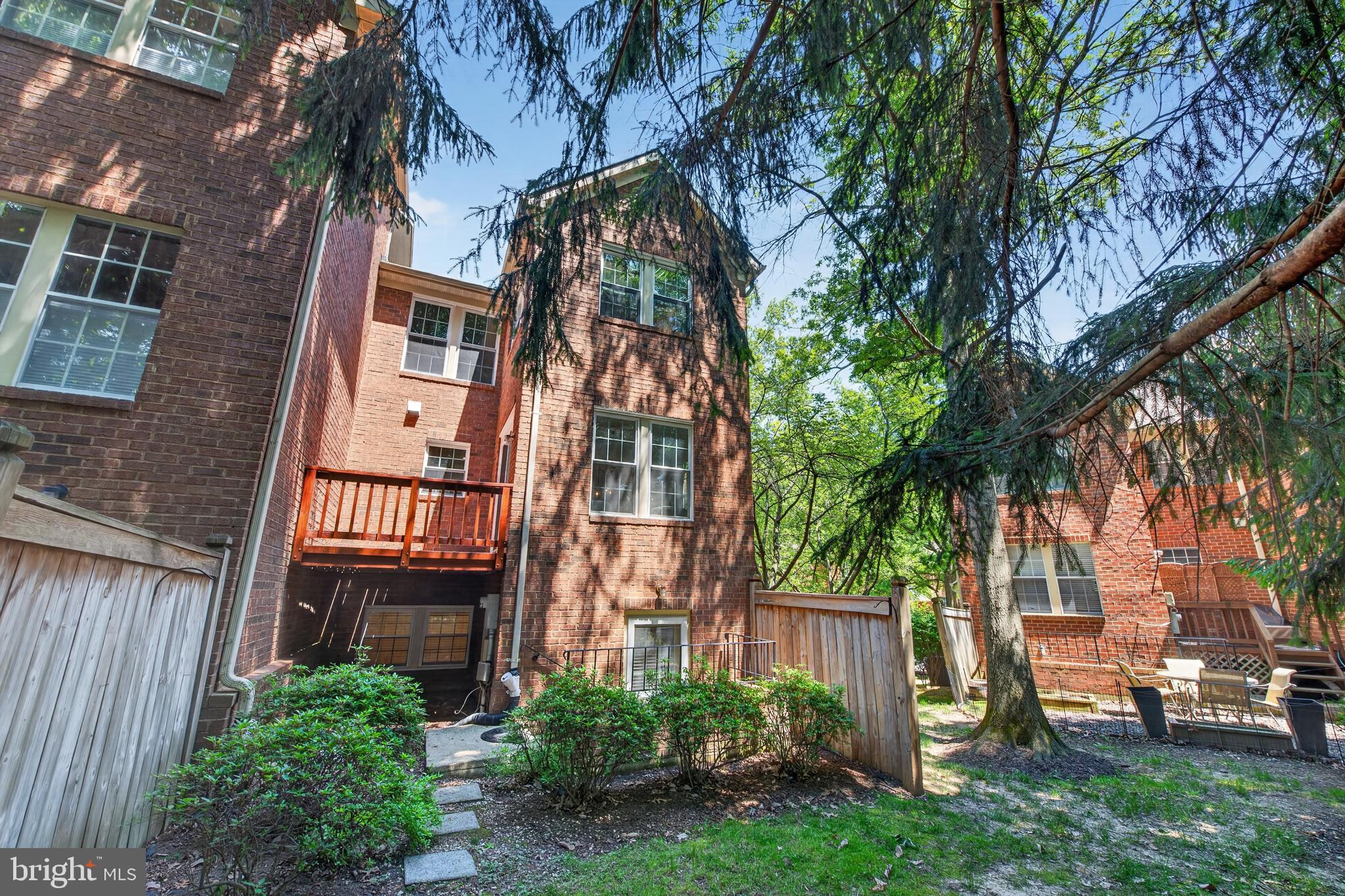 1409 Park Garden Lane Reston, VA 20194 - Photo 33 of 41 a backyard of a house with a garden and outdoor seating