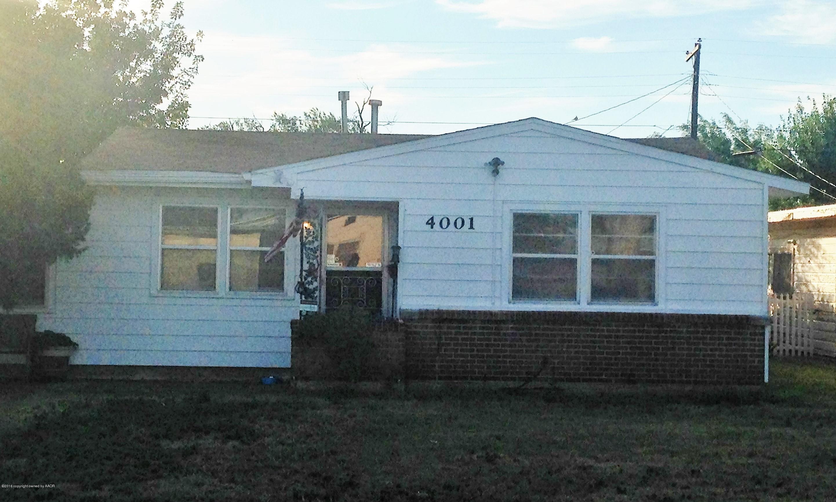 4001 South Monroe Street Amarillo, TX 79110 - Photo 1 of 1 a front view of a house with a garden